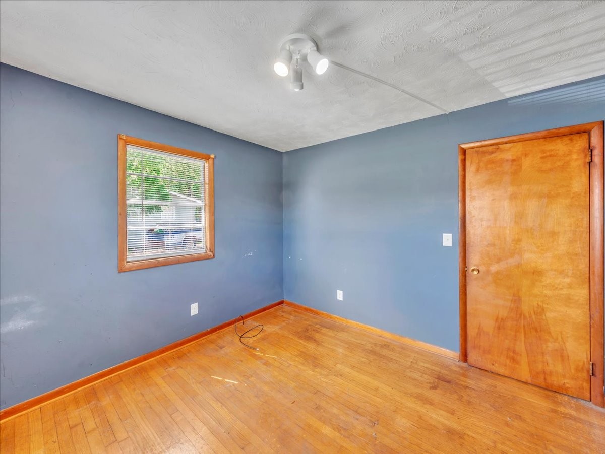 707 Molino Road Taft, TN 38488 - Photo 23 of 28 an empty room with windows and closet