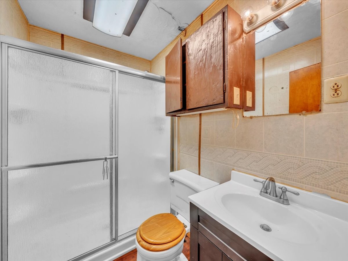 707 Molino Road Taft, TN 38488 - Photo 24 of 28 a bathroom with a sink a mirror and a toilet