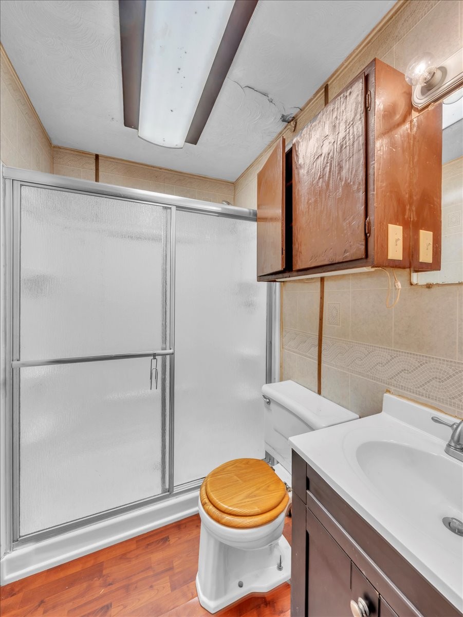 707 Molino Road Taft, TN 38488 - Photo 25 of 28 a bathroom with a sink a toilet and a shower