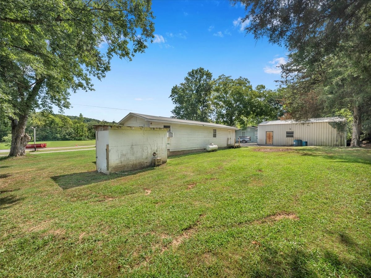 707 Molino Road Taft, TN 38488 - Photo 4 of 28 a view of a house with a yard