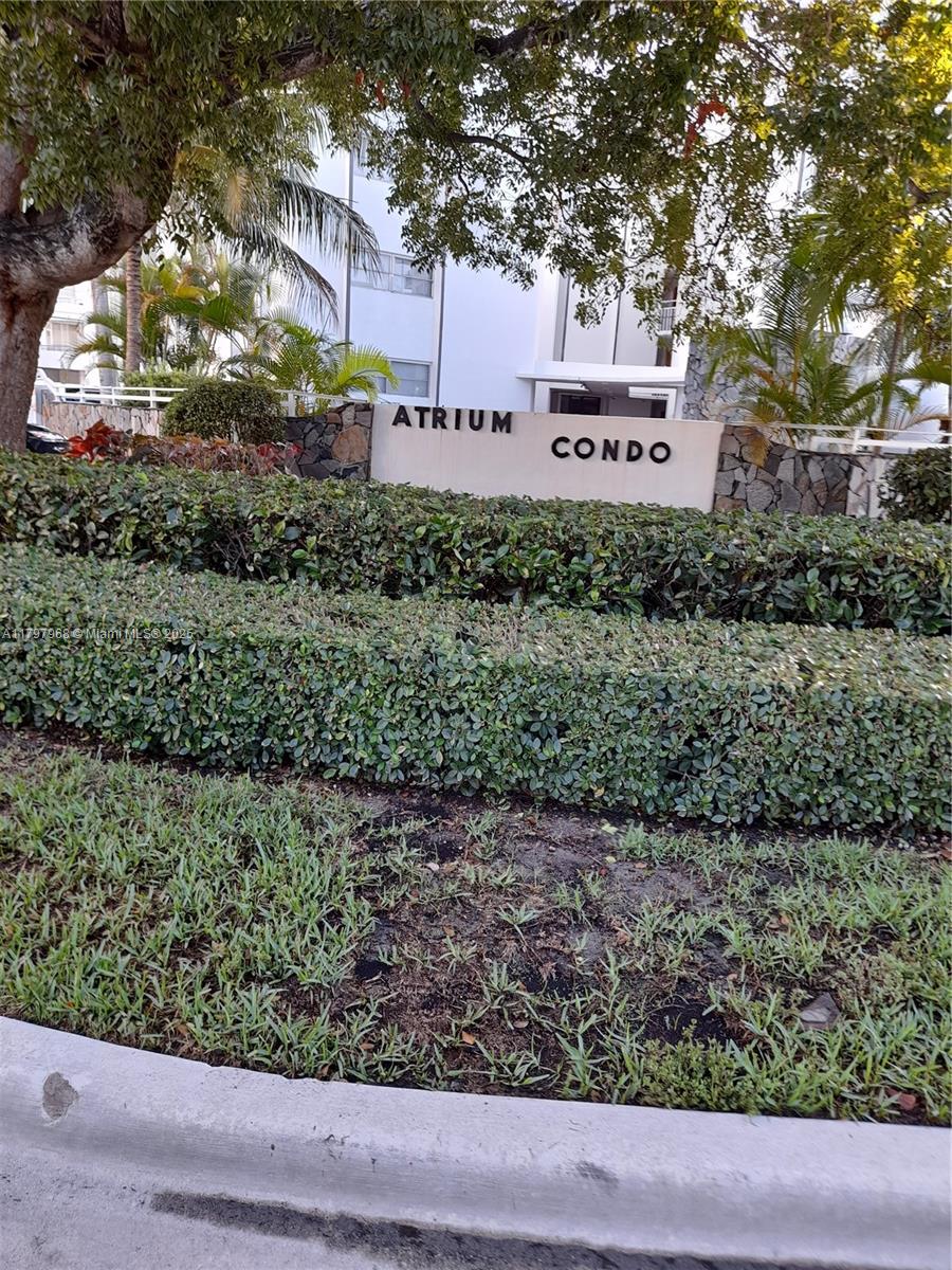 1075 93rd Street, Unit 404 Bay Harbor Islands, FL 33154 - Photo 11 of 14 a sign that is sitting on a brick wall