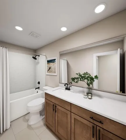 a bathroom with a double vanity sink toilet mirror and bathtub