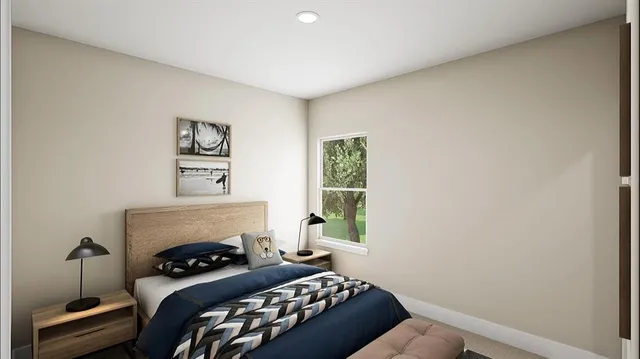 a bedroom with a bed and a fireplace