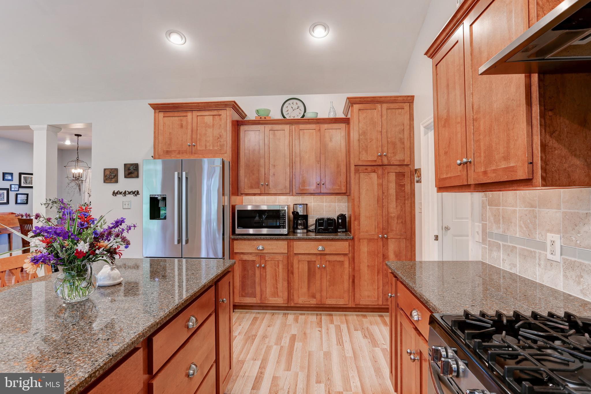 10 Elser Hill Road Lititz, PA 17543 - Photo 14 of 63 a kitchen with stainless steel appliances granite countertop a stove refrigerator and cabinets