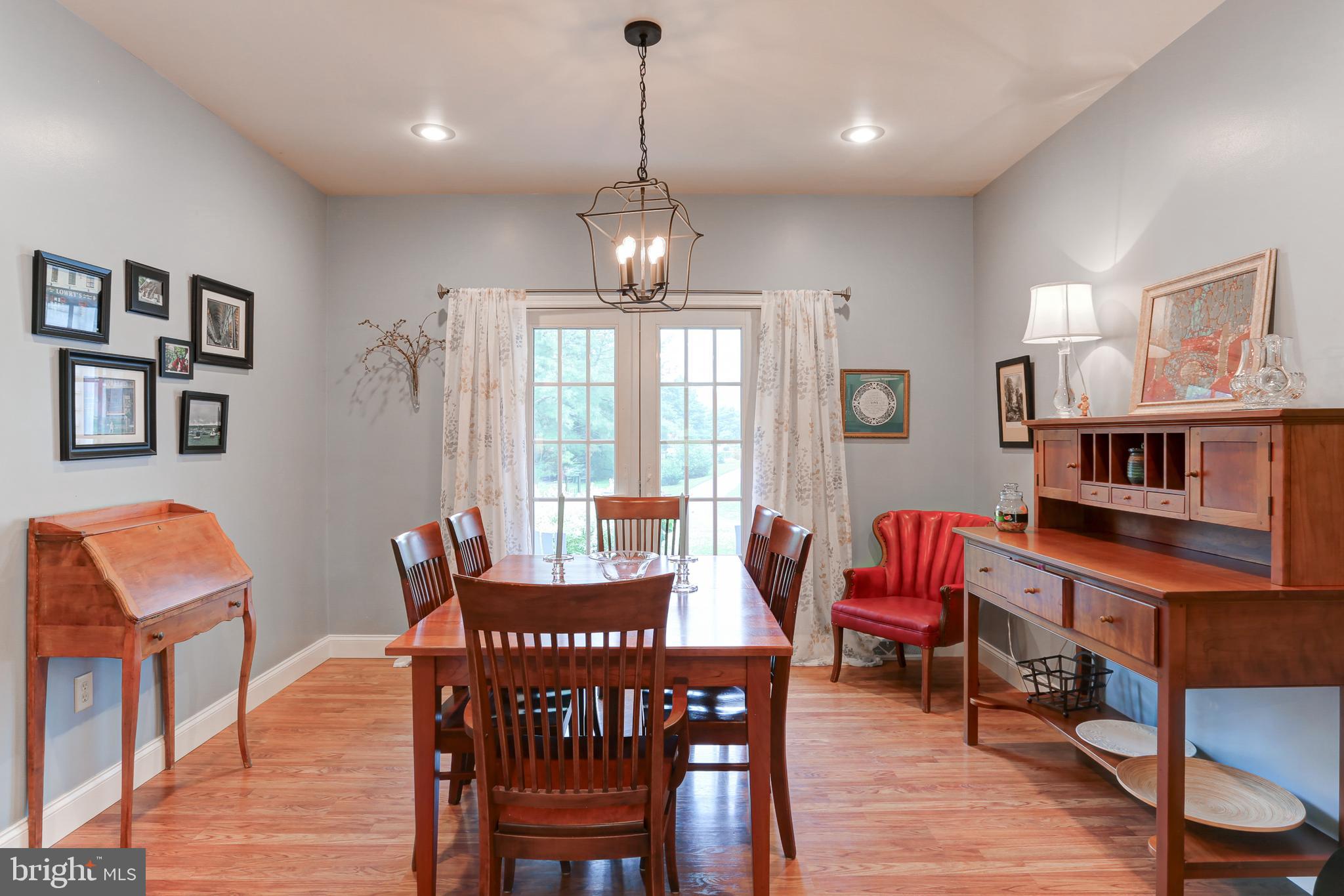 10 Elser Hill Road Lititz, PA 17543 - Photo 16 of 63 a view of a dining room with furniture window and wooden floor