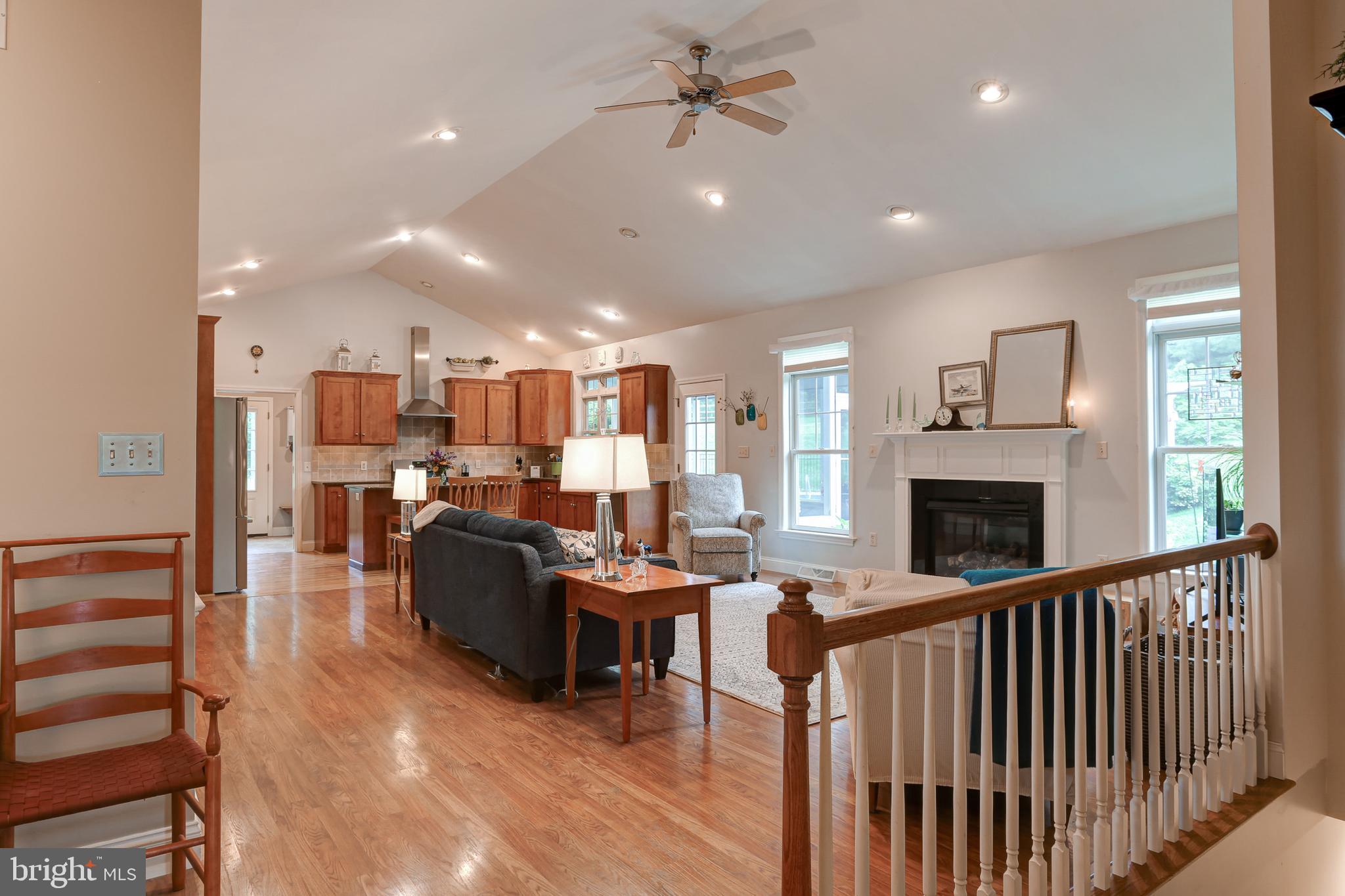 10 Elser Hill Road Lititz, PA 17543 - Photo 18 of 63 a living room with lots of furniture a fireplace and a book