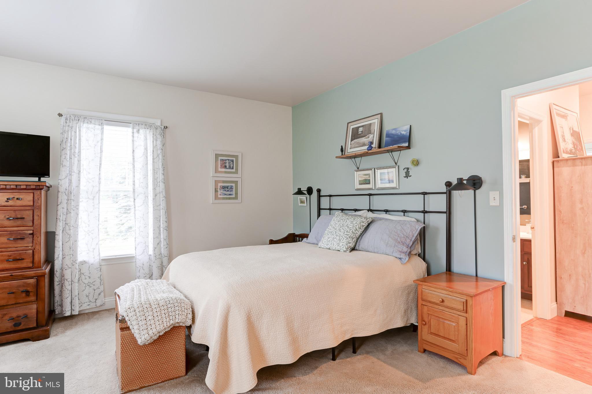 10 Elser Hill Road Lititz, PA 17543 - Photo 22 of 63 a bedroom with a bed and a flat screen tv