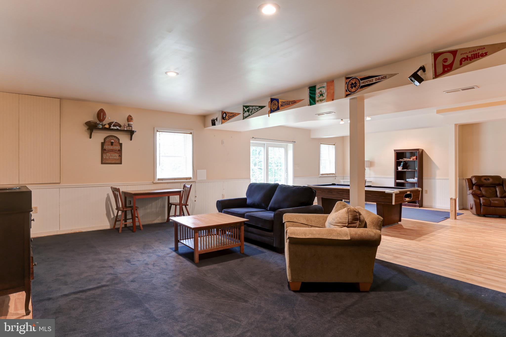10 Elser Hill Road Lititz, PA 17543 - Photo 36 of 63 a living room with furniture and a dining table with wooden floor