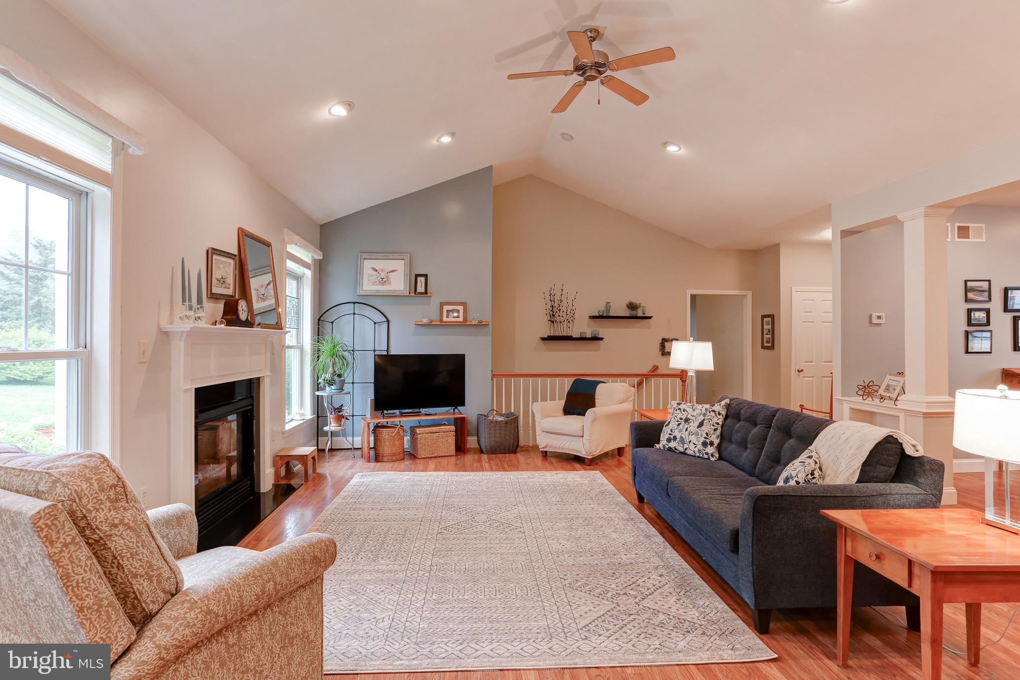 10 Elser Hill Road Lititz, PA 17543 - Photo 8 of 63 a living room with furniture a fireplace and a flat screen tv