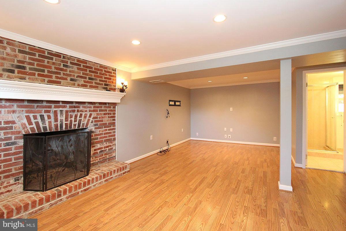 19225 Staleybridge Road Germantown, MD 20876 - Photo 19 of 27 Lower Level w/Fireplace