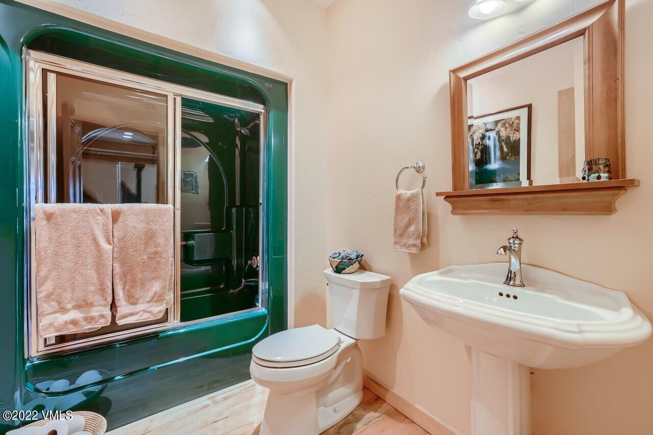 417 Neilson Gulch Road Eagle, CO 81631 - Photo 13 of 28 a bathroom with a sink a toilet and shower