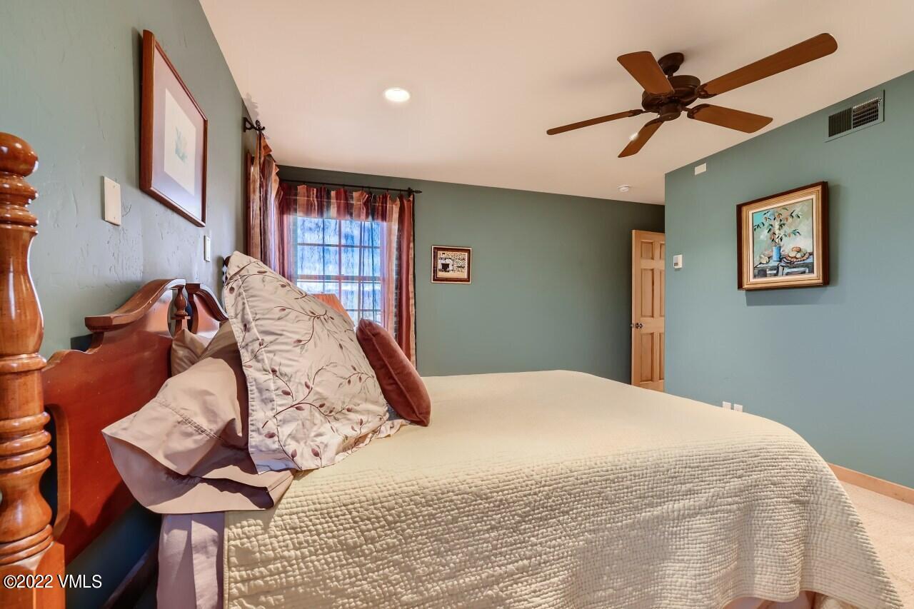 417 Neilson Gulch Road Eagle, CO 81631 - Photo 15 of 28 a bedroom with a bed and window