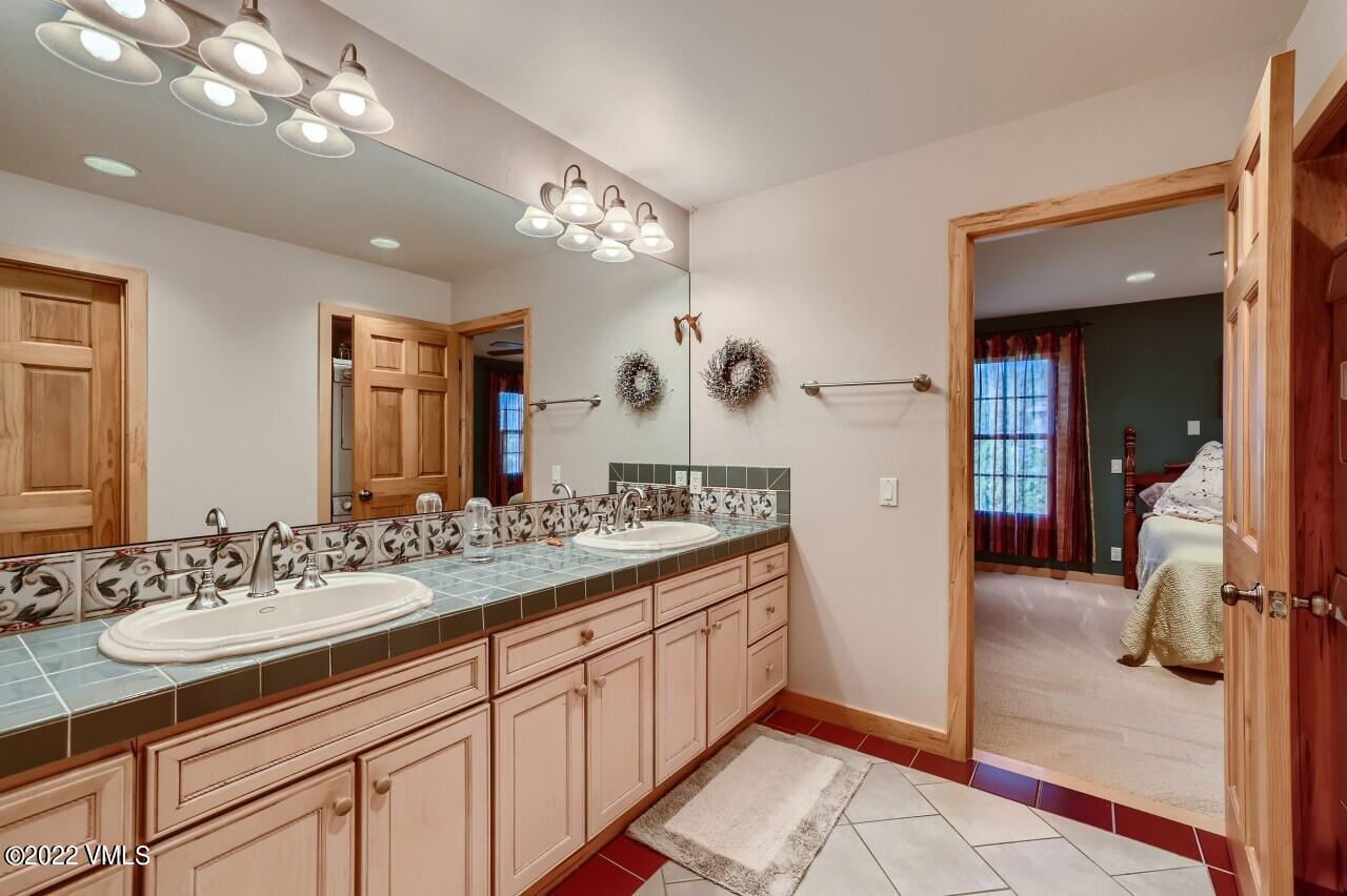 417 Neilson Gulch Road Eagle, CO 81631 - Photo 17 of 28 a bathroom with a sink double vanity and a mirror