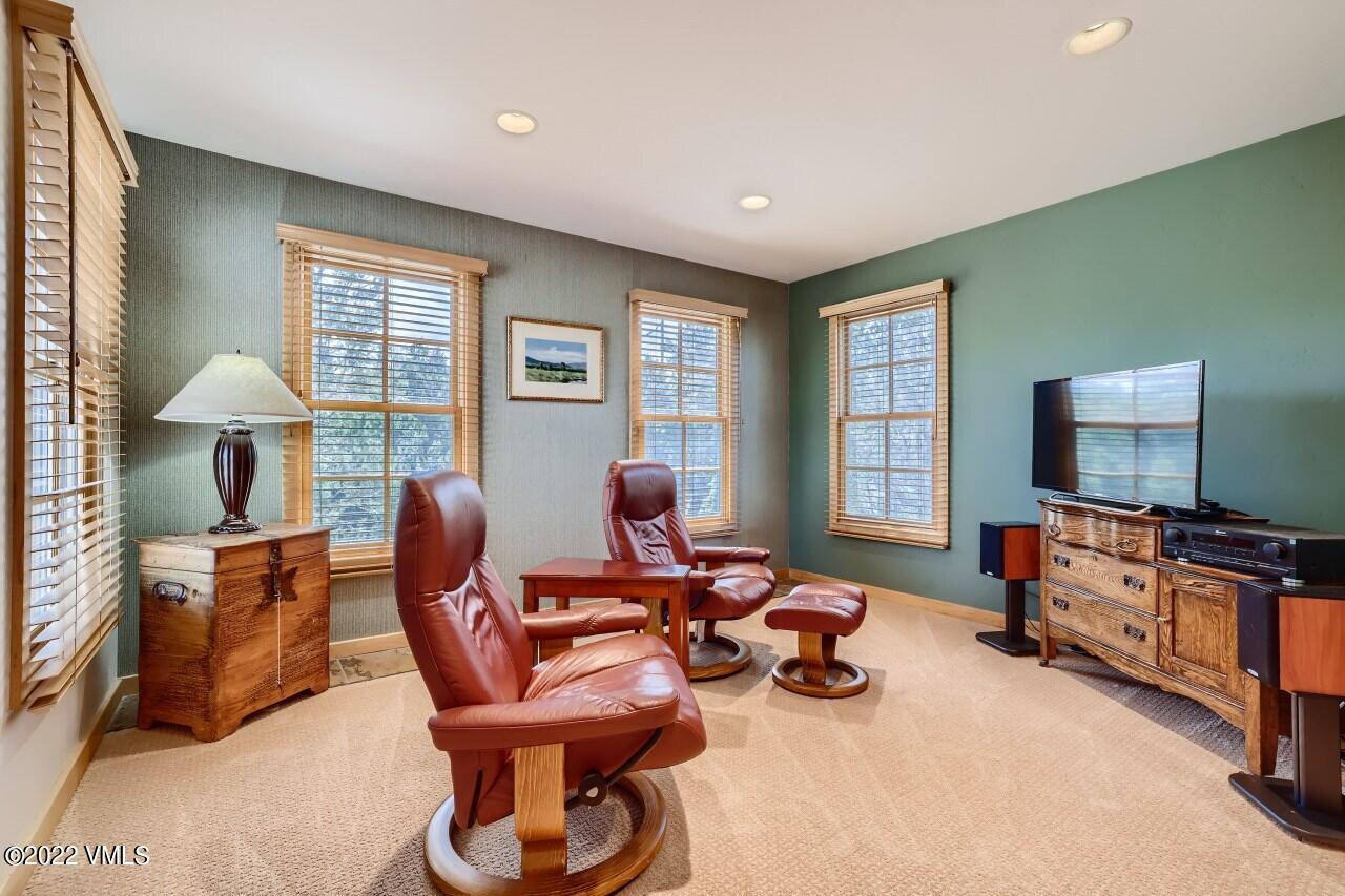 417 Neilson Gulch Road Eagle, CO 81631 - Photo 19 of 28 a living room with furniture a flat screen tv and a window