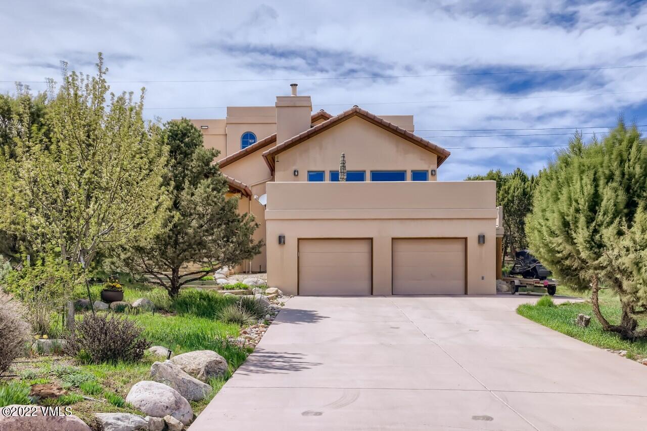 417 Neilson Gulch Road Eagle, CO 81631 - Photo 2 of 28 a front view of a house with a yard and trees