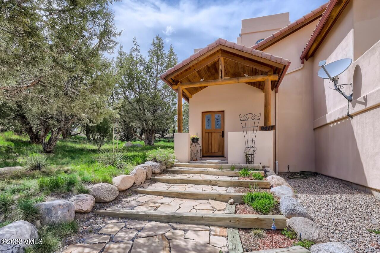417 Neilson Gulch Road Eagle, CO 81631 - Photo 3 of 28 a front view of a house with garden