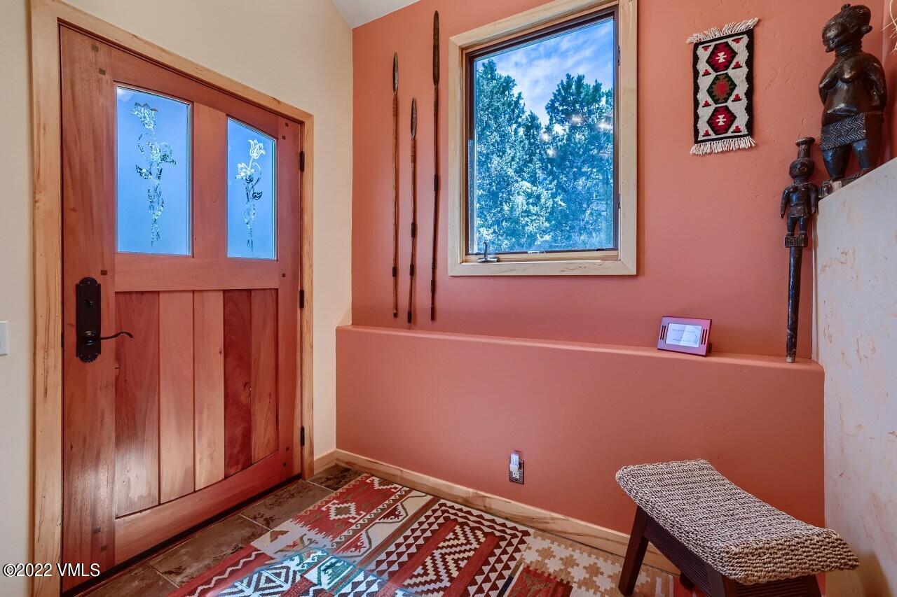 417 Neilson Gulch Road Eagle, CO 81631 - Photo 4 of 28 a view of a room with a window and wooden floor