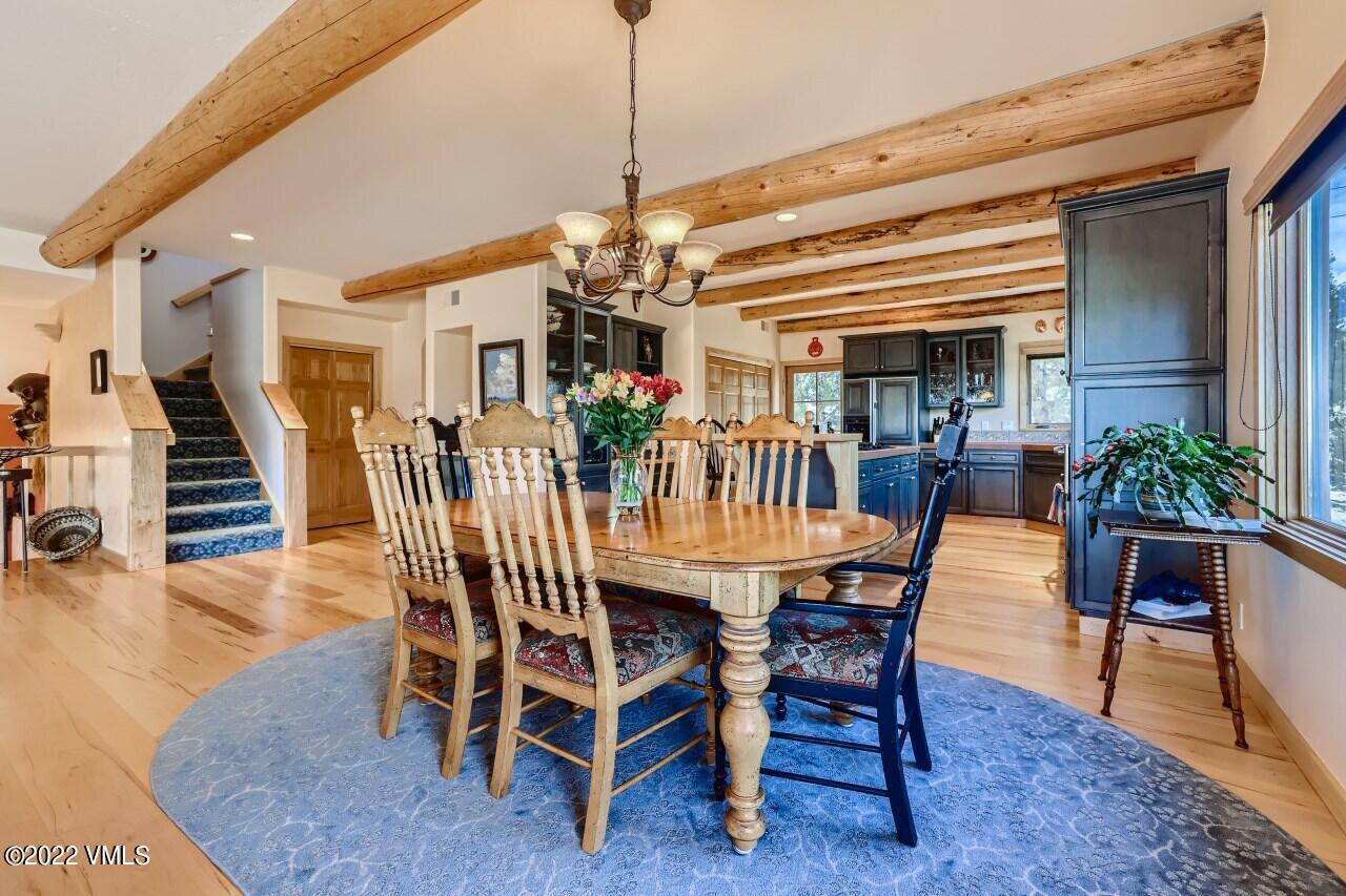417 Neilson Gulch Road Eagle, CO 81631 - Photo 8 of 28 a dining room with furniture entryway and wooden floor