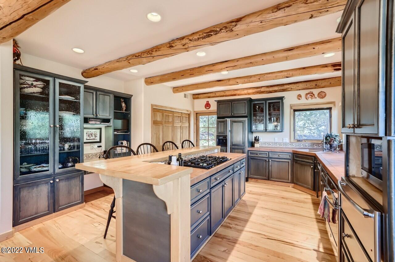 417 Neilson Gulch Road Eagle, CO 81631 - Photo 10 of 28 a kitchen with granite countertop a sink and counter space