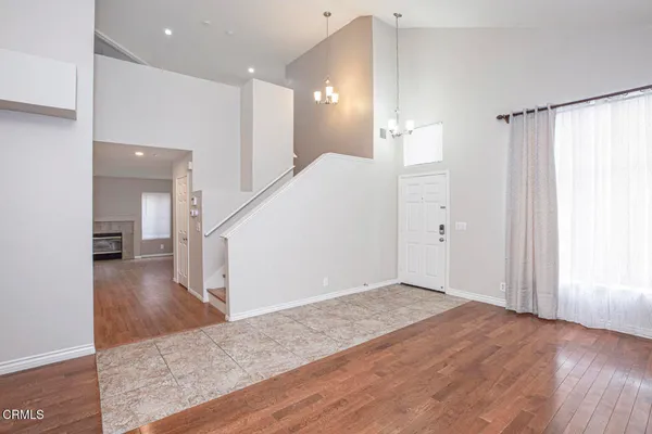 a bathroom with a granite countertop sink and a bathtub
