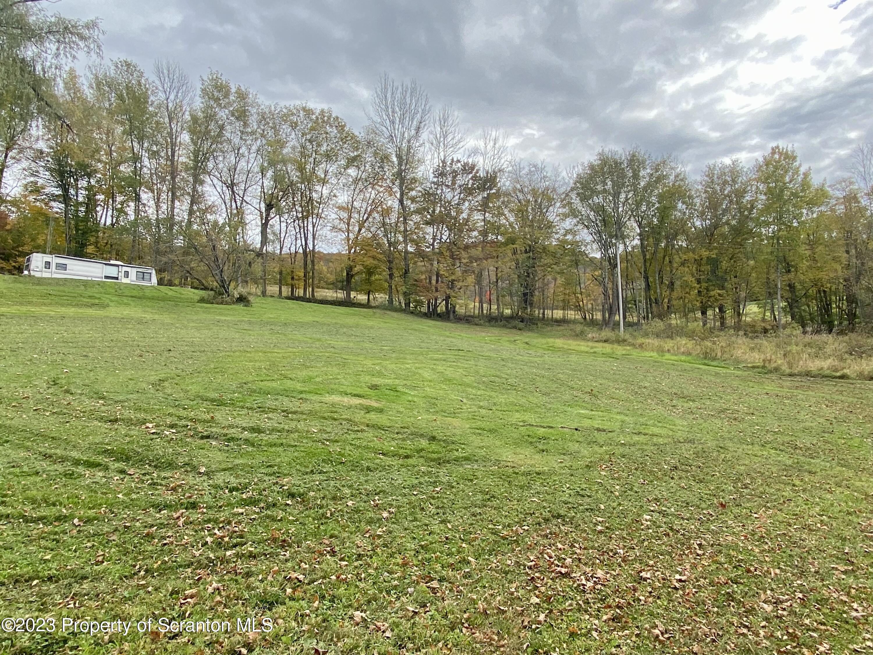 65 Powell Road Union Dale, PA 18470 - Photo 12 of 20 a big yard with lots of green space and trees