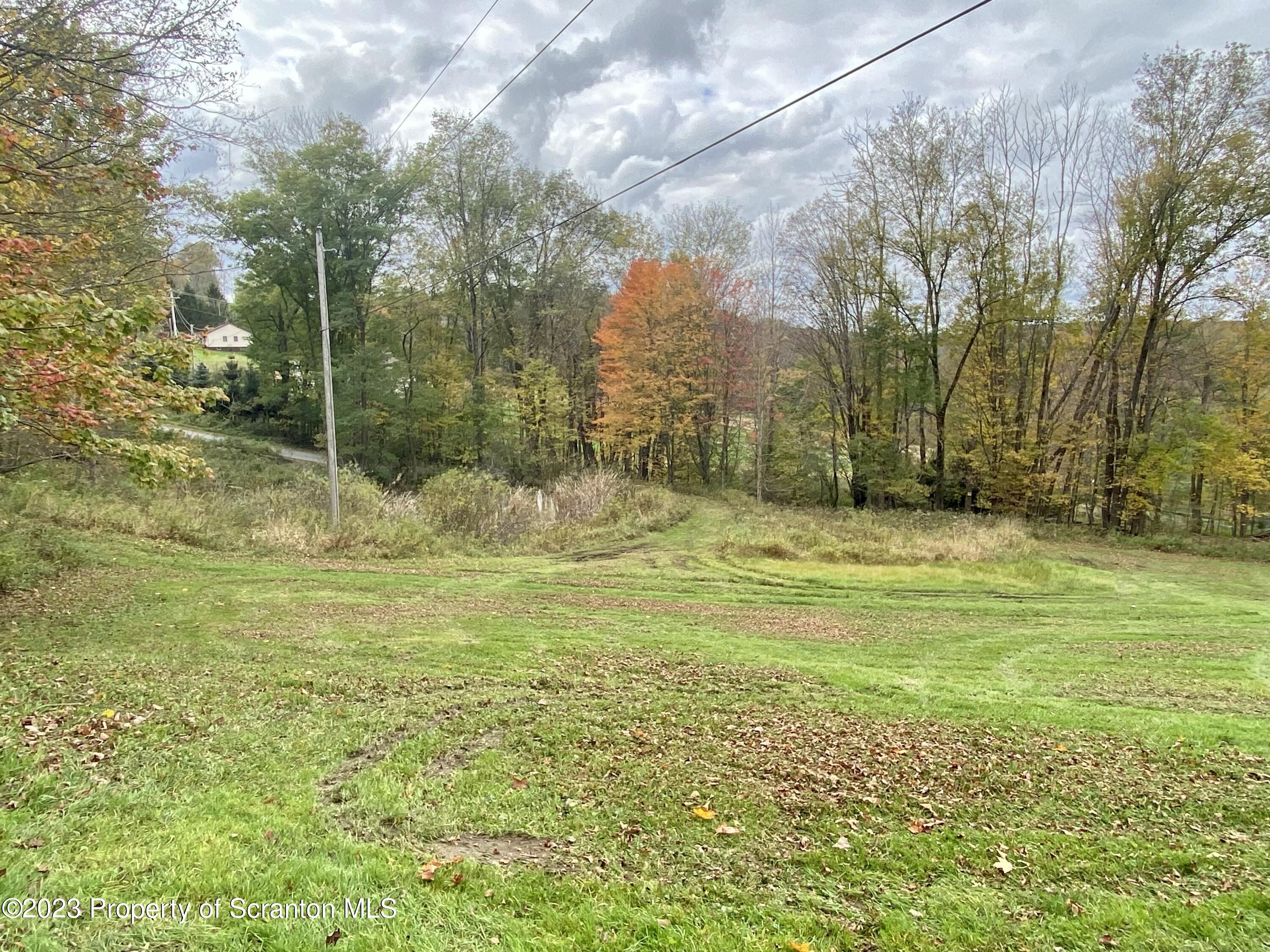 65 Powell Road Union Dale, PA 18470 - Photo 4 of 20 a swimming pool with an outdoor space and seating