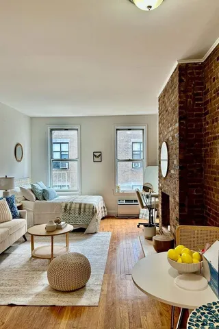 a living room with furniture rug and window