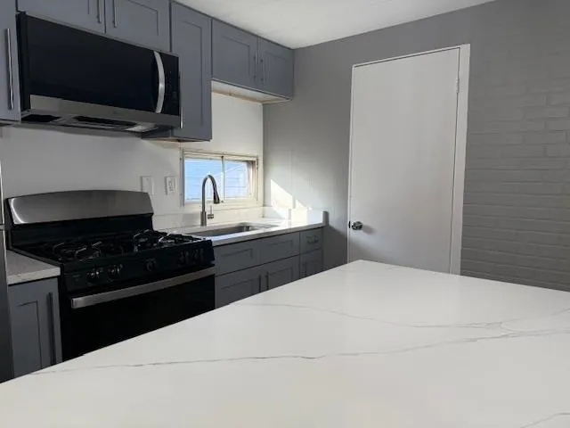 a kitchen with a stove and a microwave