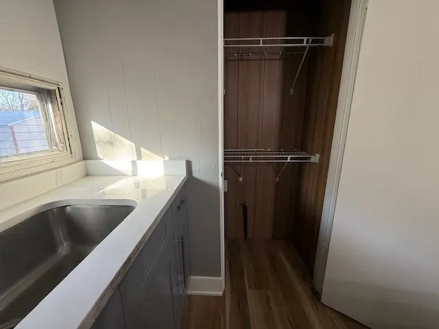 a view of walk in closet with clothes