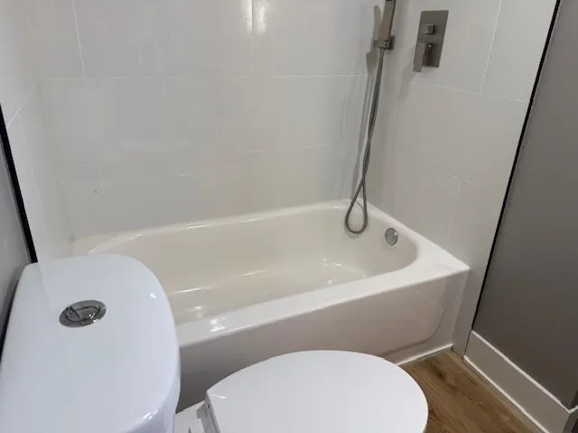 a bathroom with a toilet and a sink