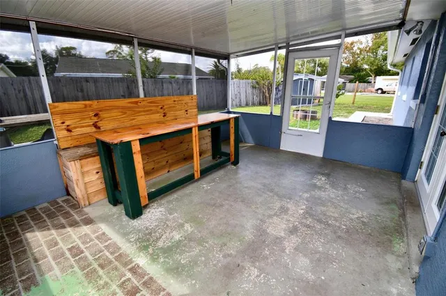 a kitchen with stainless steel appliances a dining table and chairs