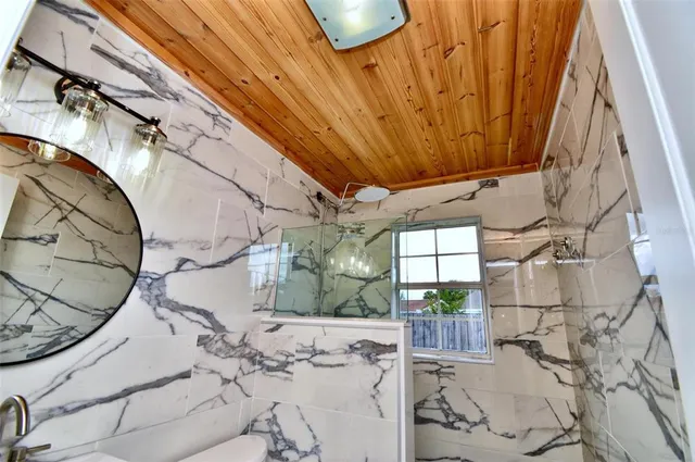 a bedroom with furniture and flat screen tv