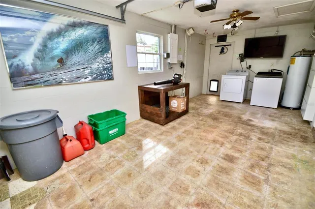 a view of storage and utility room with a flat screen tv