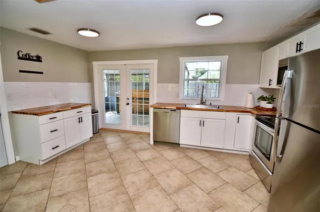 a kitchen with a stove microwave and sink