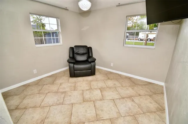 a living room with furniture and a window