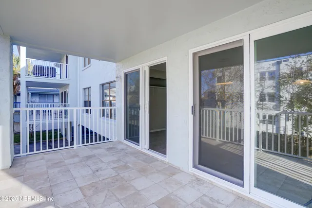 a view of a brick building with large windows