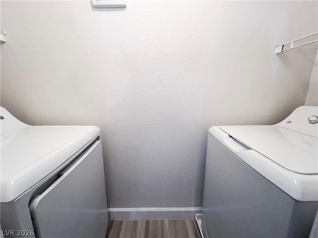 8101 West Flamingo Road, Unit 2129 Las Vegas, NV 89147 - Photo 4 of 12 A well-organized laundry area offers a convenient space for everyday chores.