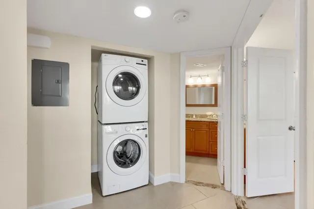 a utility room with sink dryer and washer
