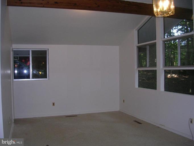 2704 Hidden Valley Road Accokeek, MD 20607 - Photo 11 of 15 an empty room with chandelier fan