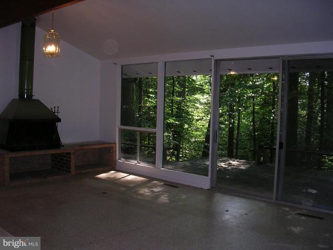 2704 Hidden Valley Road Accokeek, MD 20607 - Photo 4 of 15 a view of backyard with green space and glass door