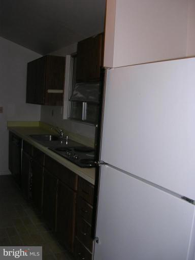 2704 Hidden Valley Road Accokeek, MD 20607 - Photo 9 of 15 a kitchen with a sink and cabinets