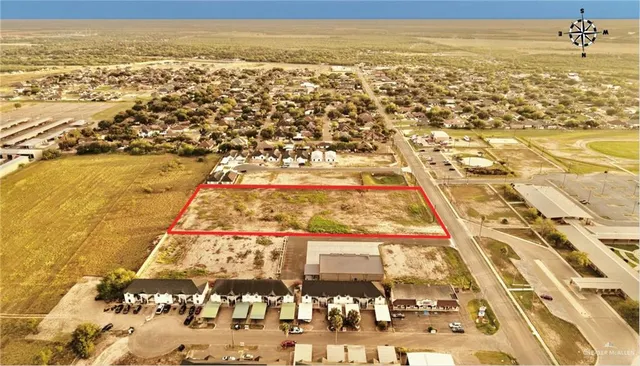 an aerial view of residential building and parking space