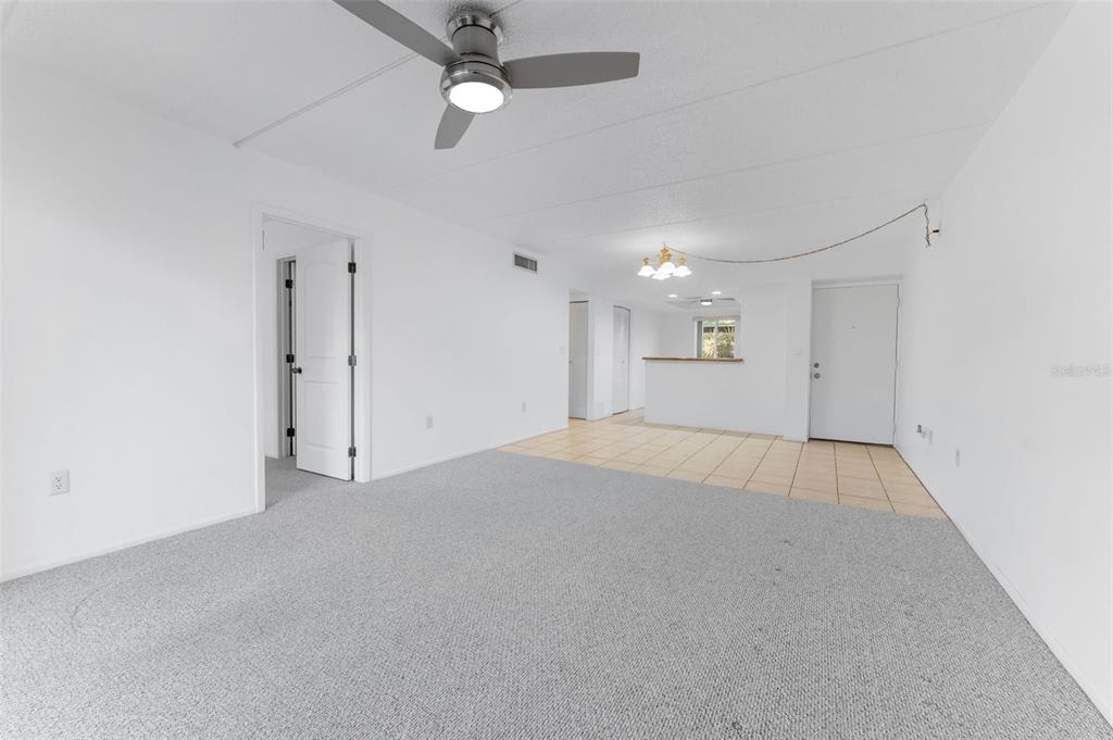 219 Cypress Court, Unit 219 Oldsmar, FL 34677 - Photo 11 of 34 an empty room with fan and windows