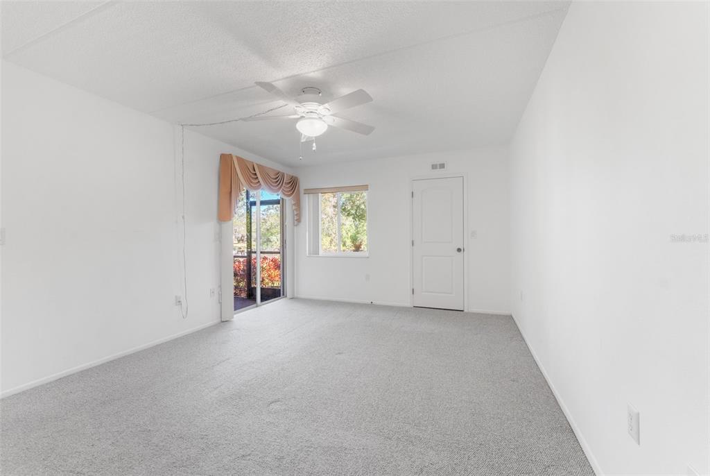 219 Cypress Court, Unit 219 Oldsmar, FL 34677 - Photo 16 of 34 an empty room with windows and closet