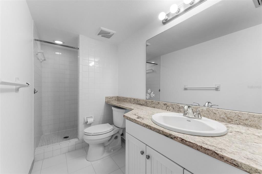 219 Cypress Court, Unit 219 Oldsmar, FL 34677 - Photo 18 of 34 a bathroom with a sink toilet and a mirror
