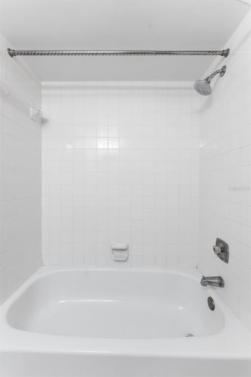 219 Cypress Court, Unit 219 Oldsmar, FL 34677 - Photo 24 of 34 a bathroom with a shower and a bathtub