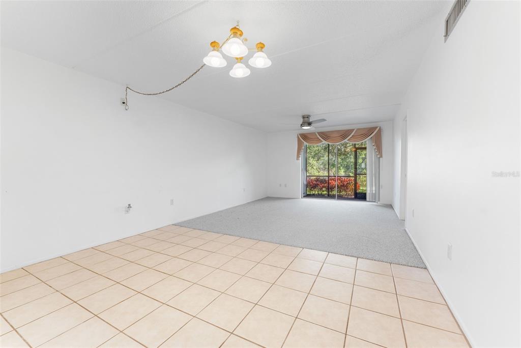 219 Cypress Court, Unit 219 Oldsmar, FL 34677 - Photo 9 of 34 a view of an empty room and window