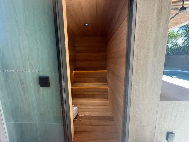 a bathroom with a shower and a sink