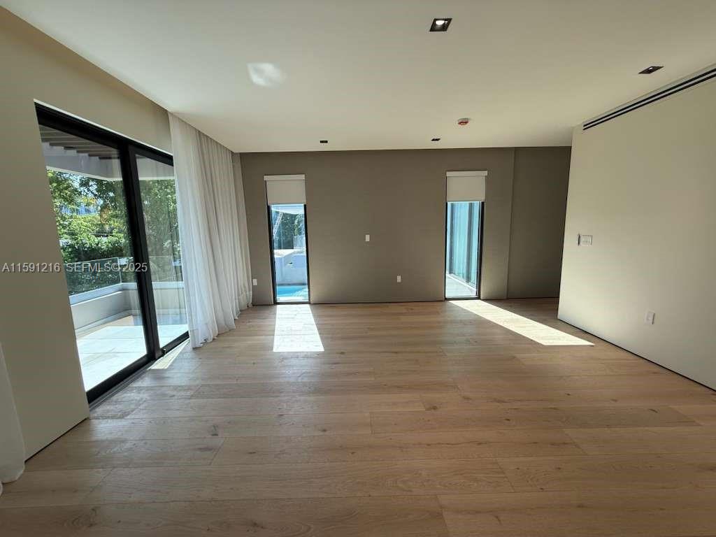 135 Southwest 29th Road Miami, FL 33129 - Photo 37 of 69 a view of an empty room with glass door and a window