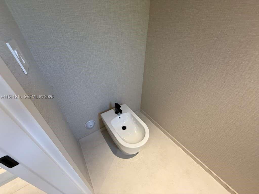 135 Southwest 29th Road Miami, FL 33129 - Photo 47 of 69 a bathroom with a toilet and sink